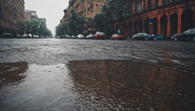 outdoors,sky,tree,no humans,ground vehicle,building,scenery,motor vehicle,city,car,road,bridge,lamppost,street,real world location,day,blurry,window,vehicle focus,puddle,photo background,sports car