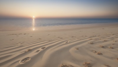 outdoors,sky,day,water,no humans,shadow,ocean,beach,scenery,sunset,rock,sand,sun,horizon,shore,desert,footprints,vehicle focus