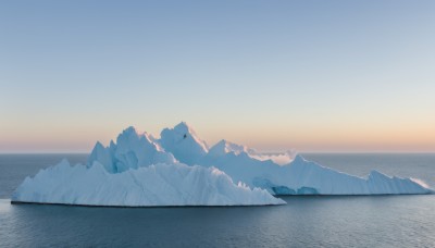 outdoors,sky,day,water,blurry,blue sky,no humans,ocean,scenery,snow,sunset,ice,mountain,horizon,landscape,mountainous horizon,lake,gradient sky,sunrise,cloud,sun