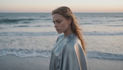 1girl,solo,long hair,blue eyes,blonde hair,brown hair,shirt,dress,closed mouth,white shirt,upper body,outdoors,day,water,white dress,blurry,from side,lips,blurry background,ocean,beach,freckles,realistic,nose,sand,sky,depth of field,looking down,horizon,waves,shore