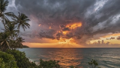 outdoors,sky,cloud,water,tree,no humans,ocean,beach,sunlight,cloudy sky,fire,nature,scenery,smoke,sunset,sand,palm tree,horizon,shore,island,plant,waves