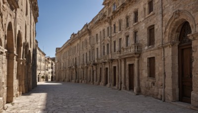 outdoors,sky,day,blue sky,no humans,window,shadow,building,scenery,city,door,road,ruins,pillar,street,arch,wall,architecture,column,pavement,stone floor,stone wall