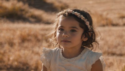 1girl,solo,short hair,brown hair,black hair,hair ornament,dress,brown eyes,closed mouth,upper body,flower,outdoors,sleeveless,hair flower,white dress,blurry,black eyes,lips,depth of field,blurry background,looking away,wind,child,realistic,nose,female child,head wreath,looking at viewer,shirt,day,sunlight,portrait