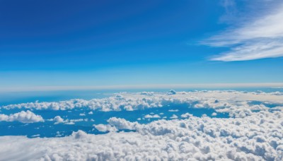 monochrome,outdoors,sky,day,cloud,blue sky,no humans,ocean,cloudy sky,scenery,blue theme,city,horizon,cityscape,landscape,above clouds,water,waves