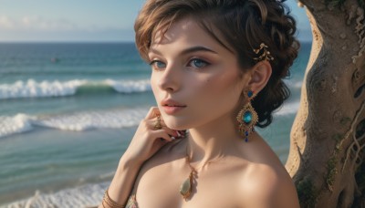 1girl,solo,looking at viewer,short hair,blue eyes,brown hair,hair ornament,bare shoulders,jewelry,collarbone,upper body,earrings,outdoors,parted lips,sky,day,hand up,water,necklace,mole,blurry,bracelet,tree,lips,mole under eye,depth of field,blurry background,ocean,beach,ring,gem,portrait,freckles,realistic,nose,sand,mole on cheek,breasts,black hair,cleavage,nail polish,fingernails,eyelashes,gold