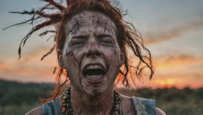 1girl,solo,looking at viewer,open mouth,blue eyes,brown hair,jewelry,outdoors,sky,teeth,necklace,blurry,blurry background,messy hair,portrait,realistic,horror (theme),dreadlocks,long hair,1boy,male focus,dirty,dirty face