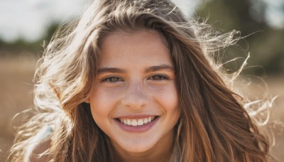 1girl,solo,long hair,looking at viewer,smile,open mouth,brown hair,brown eyes,outdoors,teeth,day,grin,blurry,lips,depth of field,blurry background,messy hair,portrait,forehead,realistic,:d,artist name