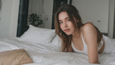 1girl,solo,long hair,breasts,looking at viewer,smile,blue eyes,brown hair,cleavage,bare shoulders,jewelry,medium breasts,underwear,earrings,lying,parted lips,teeth,indoors,necklace,bra,blurry,lips,pillow,bed,blurry background,bed sheet,on bed,tank top,on stomach,freckles,white bra,realistic,blanket,under covers,white tank top,small breasts,piercing,nose,door