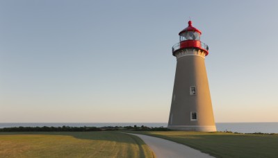 outdoors,sky,day,water,blue sky,no humans,grass,building,scenery,mountain,horizon,road,river,tower,landscape,cloud,tree,window,nature,door,field,gradient sky,sunrise,morning,lighthouse