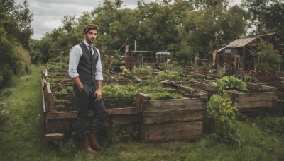 solo,looking at viewer,short hair,brown hair,shirt,black hair,1boy,standing,white shirt,male focus,boots,outdoors,necktie,sky,day,collared shirt,pants,cloud,vest,tree,facial hair,brown footwear,black pants,grass,building,nature,scenery,black necktie,beard,sleeves rolled up,hand in pocket,black vest,mustache,house,realistic