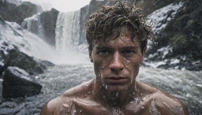 solo,looking at viewer,short hair,brown hair,black hair,1boy,closed mouth,collarbone,upper body,male focus,nude,outdoors,dark skin,water,blurry,black eyes,wet,blurry background,dark-skinned male,messy hair,portrait,snow,rock,realistic,wet hair,waterfall,brown eyes,day,lips,depth of field,facial hair