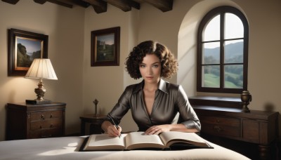 1girl,solo,breasts,looking at viewer,smile,short hair,brown hair,shirt,cleavage,brown eyes,medium breasts,sitting,closed mouth,collarbone,upper body,day,collared shirt,indoors,lips,book,window,dress shirt,shadow,table,sunlight,light smile,curtains,grey shirt,desk,sleeves rolled up,curly hair,open book,realistic,nose,pen,lamp,photo (object),quill,open window,desk lamp,black hair,holding,tree,makeup,painting (object),afro