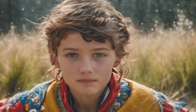 1girl,solo,looking at viewer,short hair,brown hair,brown eyes,jewelry,closed mouth,upper body,outdoors,blurry,black eyes,lips,eyelashes,depth of field,blurry background,messy hair,portrait,freckles,curly hair,realistic,nose,earrings,day,grey eyes,sunlight,grass,backlighting,bokeh