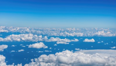 monochrome,outdoors,sky,day,cloud,blue sky,no humans,bird,ocean,cloudy sky,scenery,blue theme,horizon,cityscape,landscape,above clouds,building,city