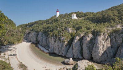 outdoors,sky,day,tree,blue sky,no humans,shadow,grass,building,nature,scenery,forest,rock,mountain,road,bush,river,tower,landscape,path,cliff