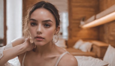 1girl,solo,looking at viewer,short hair,blonde hair,brown hair,black hair,bare shoulders,jewelry,collarbone,upper body,multicolored hair,earrings,parted lips,indoors,blurry,black eyes,two-tone hair,lips,pillow,bed,depth of field,blurry background,forehead,realistic,nose,shirt,brown eyes,sunlight,portrait,head rest,red lips