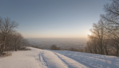 outdoors,sky,day,cloud,water,tree,blue sky,no humans,ocean,beach,nature,scenery,snow,sunset,mountain,sand,horizon,road,winter,bare tree,landscape,shore,sunrise,footprints,sunlight,forest,sun