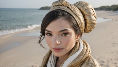 1girl,solo,looking at viewer,smile,short hair,brown hair,black hair,brown eyes,jewelry,closed mouth,earrings,outdoors,day,hair bun,blurry,lips,blurry background,ocean,beach,portrait,freckles,realistic,nose,sand,desert,bangs,water,shore