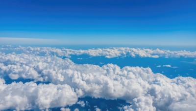 monochrome,outdoors,sky,day,cloud,blue sky,no humans,bird,ocean,cloudy sky,scenery,blue theme,horizon,landscape,above clouds,water