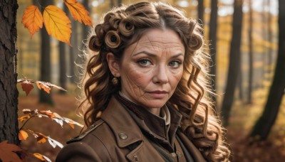 1girl,solo,long hair,looking at viewer,brown hair,brown eyes,jewelry,closed mouth,jacket,upper body,earrings,outdoors,blurry,tree,lips,coat,grey eyes,depth of field,blurry background,leaf,wavy hair,scar,portrait,nature,scar on face,curly hair,brown jacket,realistic,nose,autumn leaves,old,brown coat,autumn,falling leaves,day,sunlight,forest