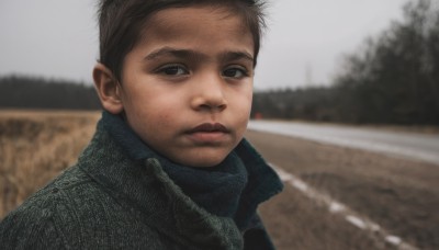 solo,looking at viewer,short hair,brown hair,black hair,1boy,brown eyes,closed mouth,jacket,upper body,male focus,outdoors,blurry,black eyes,tree,blurry background,portrait,realistic,photo background,day,scarf,coat,depth of field,winter clothes