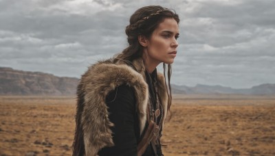 1girl,solo,long hair,blue eyes,brown hair,jewelry,closed mouth,upper body,braid,outdoors,sky,day,cloud,necklace,cape,blurry,from side,lips,looking to the side,fur trim,profile,looking away,cloudy sky,mountain,realistic,nose,looking afar,field,grey sky,coat,freckles