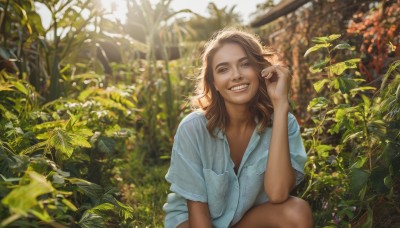 1girl,solo,long hair,looking at viewer,smile,open mouth,brown hair,shirt,brown eyes,white shirt,short sleeves,outdoors,teeth,day,collared shirt,hand up,dark skin,medium hair,grin,blurry,dark-skinned female,depth of field,blurry background,leaf,squatting,blue shirt,plant,realistic,lips,sunlight,denim,nature,pocket,breast pocket,photo background,garden