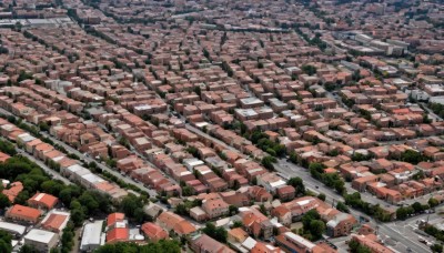 outdoors,tree,no humans,from above,building,scenery,city,road,cityscape,house,street,river,town,day,ground vehicle,nature,motor vehicle,forest,car,landscape,real world location