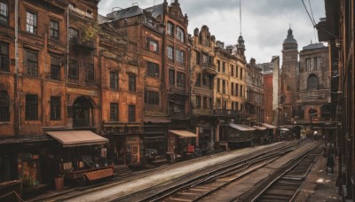 outdoors,sky,day,cloud,tree,no humans,window,cloudy sky,plant,ground vehicle,building,scenery,motor vehicle,stairs,city,sign,railing,car,road,cityscape,house,bridge,power lines,lamppost,street,train station,railroad tracks,air conditioner,real world location,vanishing point,umbrella,potted plant