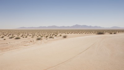 outdoors,sky,day,tree,blue sky,no humans,scenery,mountain,sand,road,field,landscape,mountainous horizon,hill,desert,beach,rock,shore