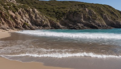 outdoors,sky,day,water,blue sky,no humans,ocean,beach,scenery,rock,mountain,sand,waves,shore,horizon,desert