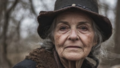 solo,looking at viewer,blue eyes,1boy,hat,closed mouth,white hair,grey hair,male focus,outdoors,blurry,tree,depth of field,blurry background,facial hair,portrait,beard,realistic,old,old man,cowboy hat,black eyes,frown,bare tree,wrinkled skin