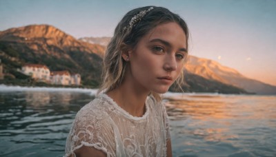 1girl,solo,looking at viewer,short hair,shirt,black hair,hair ornament,dress,jewelry,closed mouth,white shirt,upper body,short sleeves,hairband,earrings,outdoors,sky,day,dark skin,medium hair,water,white dress,blurry,black eyes,dark-skinned female,lips,depth of field,blurry background,ocean,mountain,realistic,nose,river,lake,brown hair,brown eyes,scenery