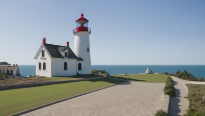 outdoors,sky,day,water,tree,blue sky,no humans,window,shadow,ocean,beach,grass,building,scenery,horizon,road,house,boat,shore,cloud,bush,wall,tower,landscape,path,lighthouse