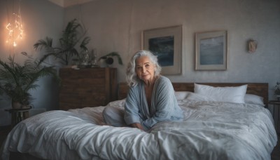 solo,long hair,looking at viewer,smile,long sleeves,1boy,sitting,closed mouth,white hair,grey hair,male focus,indoors,pillow,bed,bed sheet,facial hair,on bed,plant,beard,robe,realistic,mustache,potted plant,lamp,indian style,bedroom,old,old man,painting (object),photo (object)