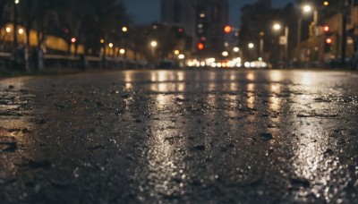 outdoors,sky,water,blurry,tree,no humans,night,depth of field,blurry background,building,night sky,scenery,reflection,city,road,cityscape,lamppost,street,river,bokeh,city lights,lights,rain,water drop,sign,puddle,pavement,reflective water