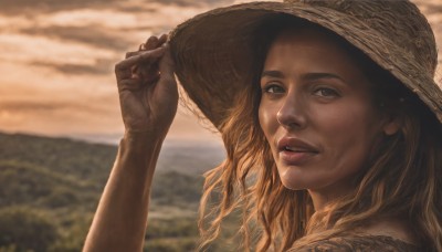 1girl,solo,long hair,looking at viewer,blonde hair,hat,brown eyes,upper body,outdoors,parted lips,sky,teeth,cloud,hand up,blurry,lips,depth of field,blurry background,portrait,freckles,sun hat,realistic,nose,straw hat,hand on headwear,brown hair,black eyes,cloudy sky,close-up