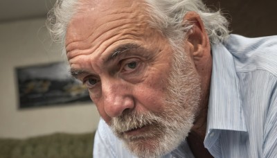 solo,looking at viewer,shirt,1boy,closed mouth,white shirt,upper body,white hair,male focus,striped,collared shirt,indoors,blurry,black eyes,blurry background,facial hair,portrait,beard,vertical stripes,striped shirt,realistic,mustache,manly,old,old man,vertical-striped shirt,wrinkled skin,grey eyes,depth of field,close-up,pinstripe pattern