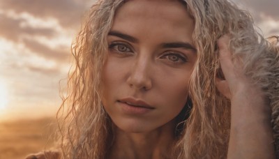 1girl,solo,long hair,looking at viewer,blonde hair,brown eyes,closed mouth,outdoors,sky,cloud,hand up,blurry,lips,eyelashes,depth of field,blurry background,wavy hair,cloudy sky,portrait,close-up,freckles,curly hair,hand in own hair,realistic,nose,parted lips,sunset