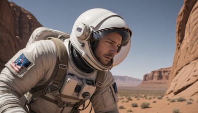 solo,1boy,closed eyes,upper body,male focus,outdoors,sky,day,blurry,military,blurry background,facial hair,helmet,beard,mountain,realistic,stubble,american flag,spacesuit,desert,astronaut,brown hair,bag,uniform,blue sky,backpack,science fiction,rock,pilot suit,united states