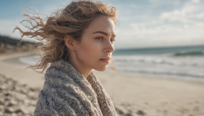 1girl, solo, long hair, looking at viewer, blonde hair, brown hair, upper body, outdoors, sky, day, blurry, lips, floating hair, depth of field, blurry background, beach, wind, realistic, nose, sand