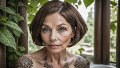 1girl,solo,looking at viewer,smile,short hair,blue eyes,brown hair,jewelry,closed mouth,collarbone,earrings,outdoors,day,blurry,lips,tattoo,blurry background,leaf,plant,portrait,realistic,nose,green eyes,upper body,nude,eyelashes,pillar