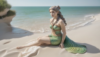 1girl,solo,long hair,breasts,looking at viewer,brown hair,dress,cleavage,bare shoulders,brown eyes,jewelry,medium breasts,sitting,full body,braid,outdoors,parted lips,barefoot,day,pointy ears,water,necklace,lips,bare legs,shadow,ocean,beach,green dress,realistic,sand,shore,navel,midriff,grass,scenery