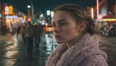 1girl,solo,short hair,blue eyes,brown hair,upper body,outdoors,parted lips,solo focus,mole,blurry,lips,coat,night,depth of field,blurry background,ground vehicle,motor vehicle,freckles,city,realistic,nose,car,road,city lights,blonde hair,closed mouth,hair bun,scarf,fur trim,single hair bun,portrait,mole under mouth,winter clothes,street,bokeh,mole on cheek