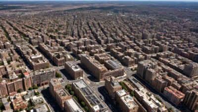 outdoors,sky,water,tree,dutch angle,no humans,ocean,from above,building,scenery,city,cityscape,river,skyscraper,landscape,rooftop,day,cloud,blue sky,ground vehicle,motor vehicle,horizon,car,road,town,real world location