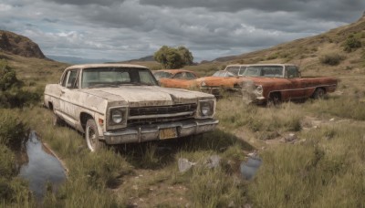 outdoors,sky,day,cloud,tree,no humans,cloudy sky,grass,ground vehicle,nature,scenery,motor vehicle,rock,mountain,car,road,vehicle focus,truck,tire,water,bucket