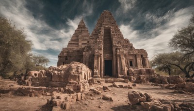 outdoors,sky,day,cloud,tree,blue sky,no humans,cloudy sky,building,nature,scenery,rock,sand,ruins,stone,rubble,statue,desert,arch