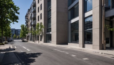 outdoors,sky,day,cloud,tree,blue sky,no humans,window,shadow,watermark,plant,building,scenery,city,road,bush,cityscape,shade,lamppost,street,crosswalk,ground vehicle,motor vehicle,car