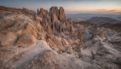 outdoors,sky,day,cloud,no humans,scenery,snow,rock,mountain,landscape,mountainous horizon,sand,desert