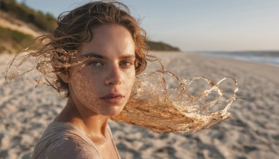 1girl,solo,long hair,looking at viewer,blue eyes,brown hair,shirt,white shirt,outdoors,parted lips,sky,day,water,blurry,lips,grey eyes,floating hair,depth of field,blurry background,ocean,beach,wind,portrait,freckles,realistic,nose,short hair,hair ornament,brown eyes,jewelry,necklace,from side,sunlight,sand,shore